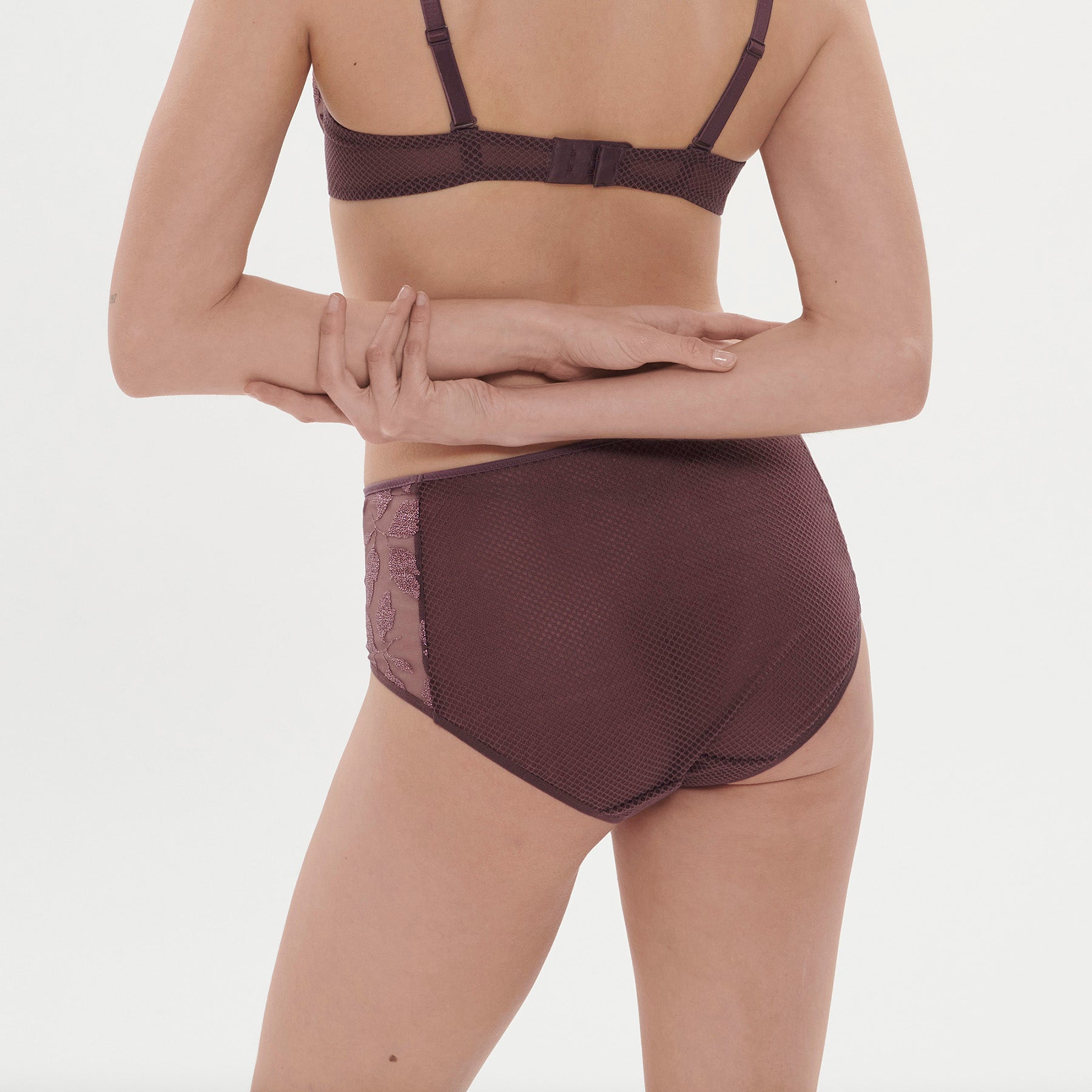 High rise full brief with embroidered side details in burgundy purple byzantine. Rear view on model.