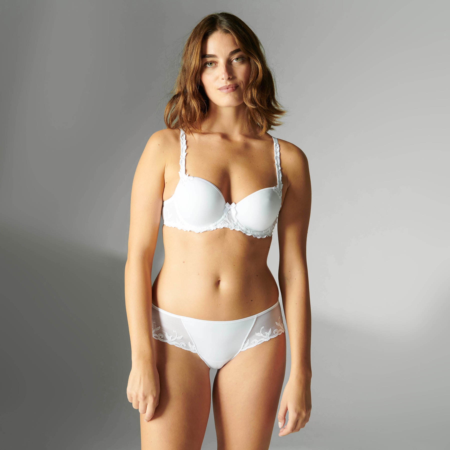 Simone Perele canada andora balcony spacer bra in white. Front view on model shown with matching shorty.