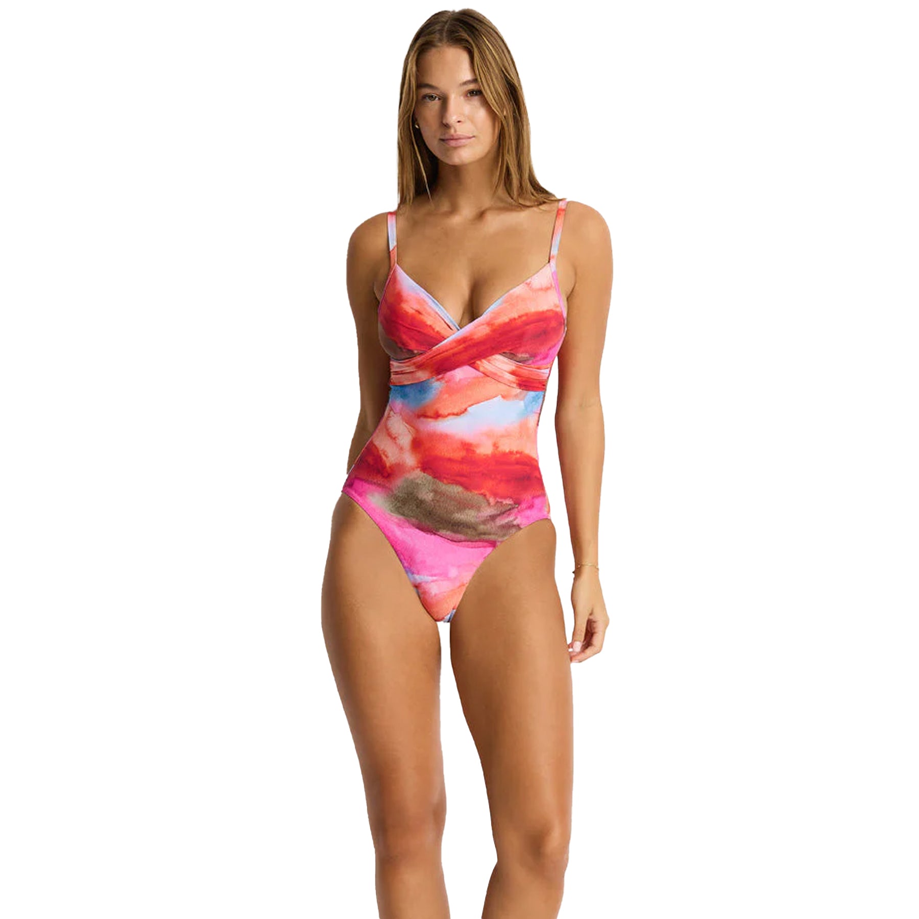 Full body front view of pink watercolor one-piece swimsuit with wrap front neckline and shaping fit on model
