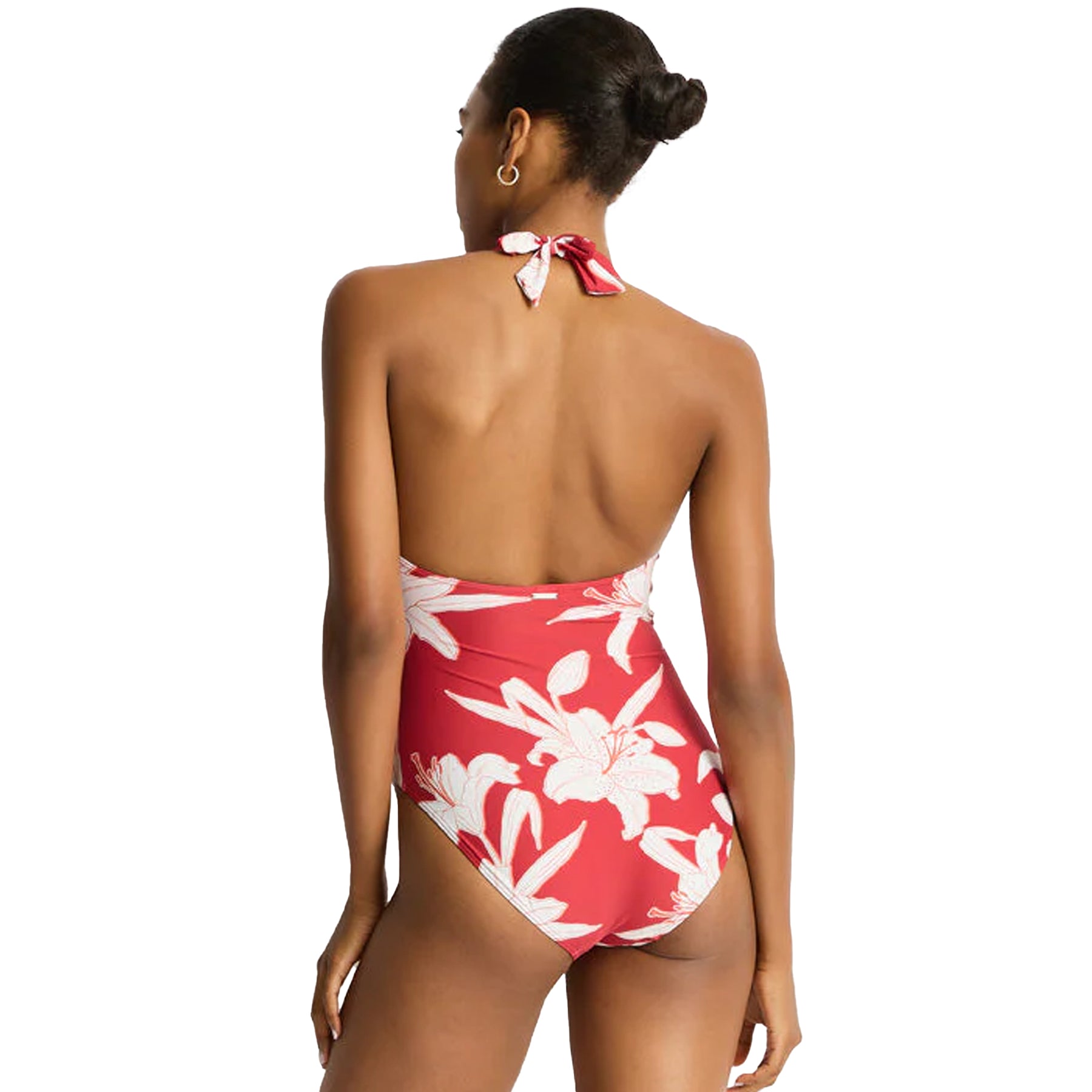 Back view of red floral halter one-piece swimsuit with open back and adjustable neck tie detail.