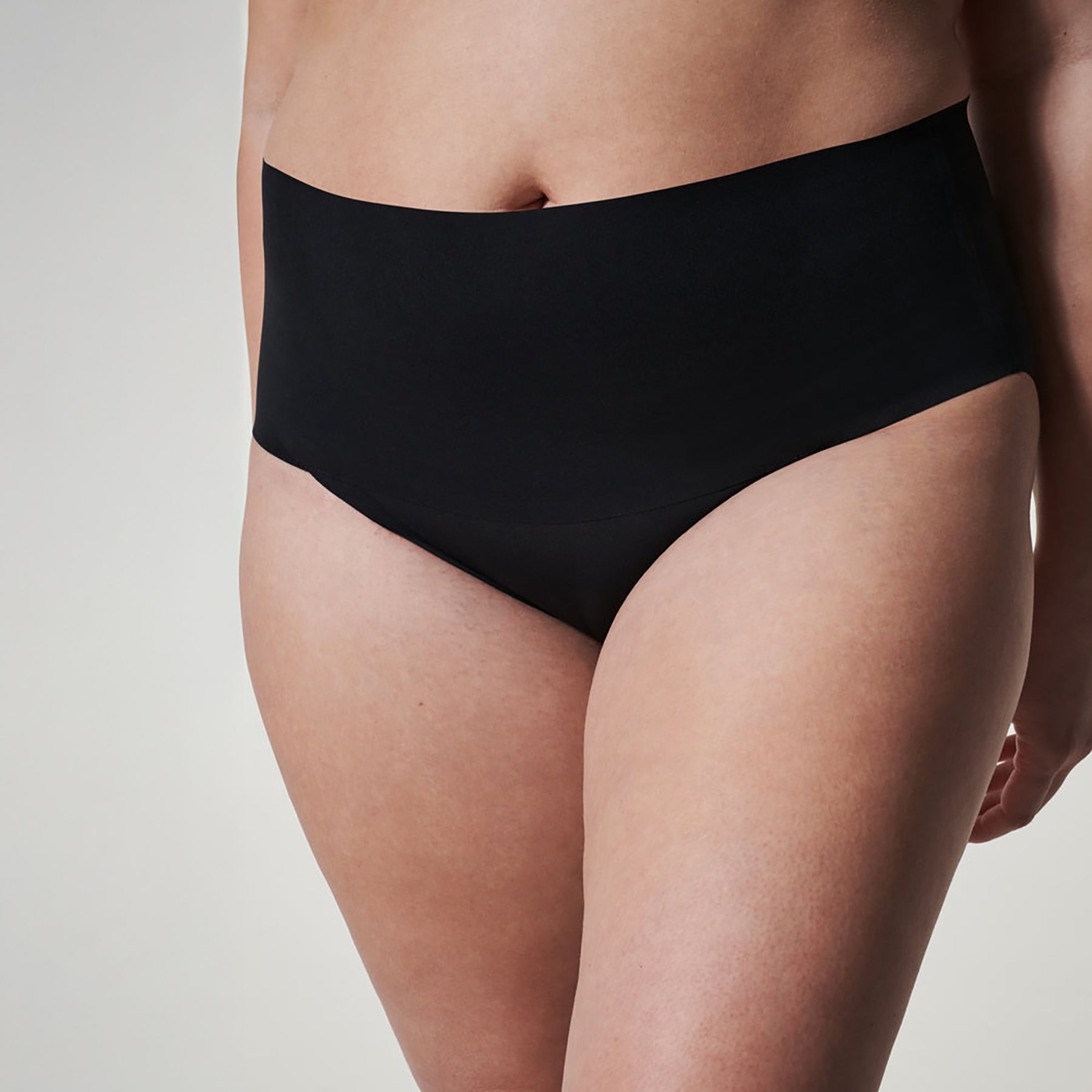 Front view of SPANX High-Waist Control Seamless Brief in Very Black, offering smoothing support and a sleek, invisible finish.