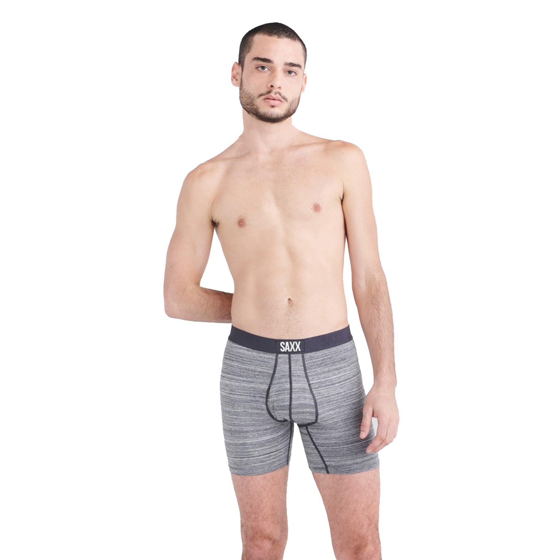 Man wearing gray boxer briefs with a visible brand logo on a white background