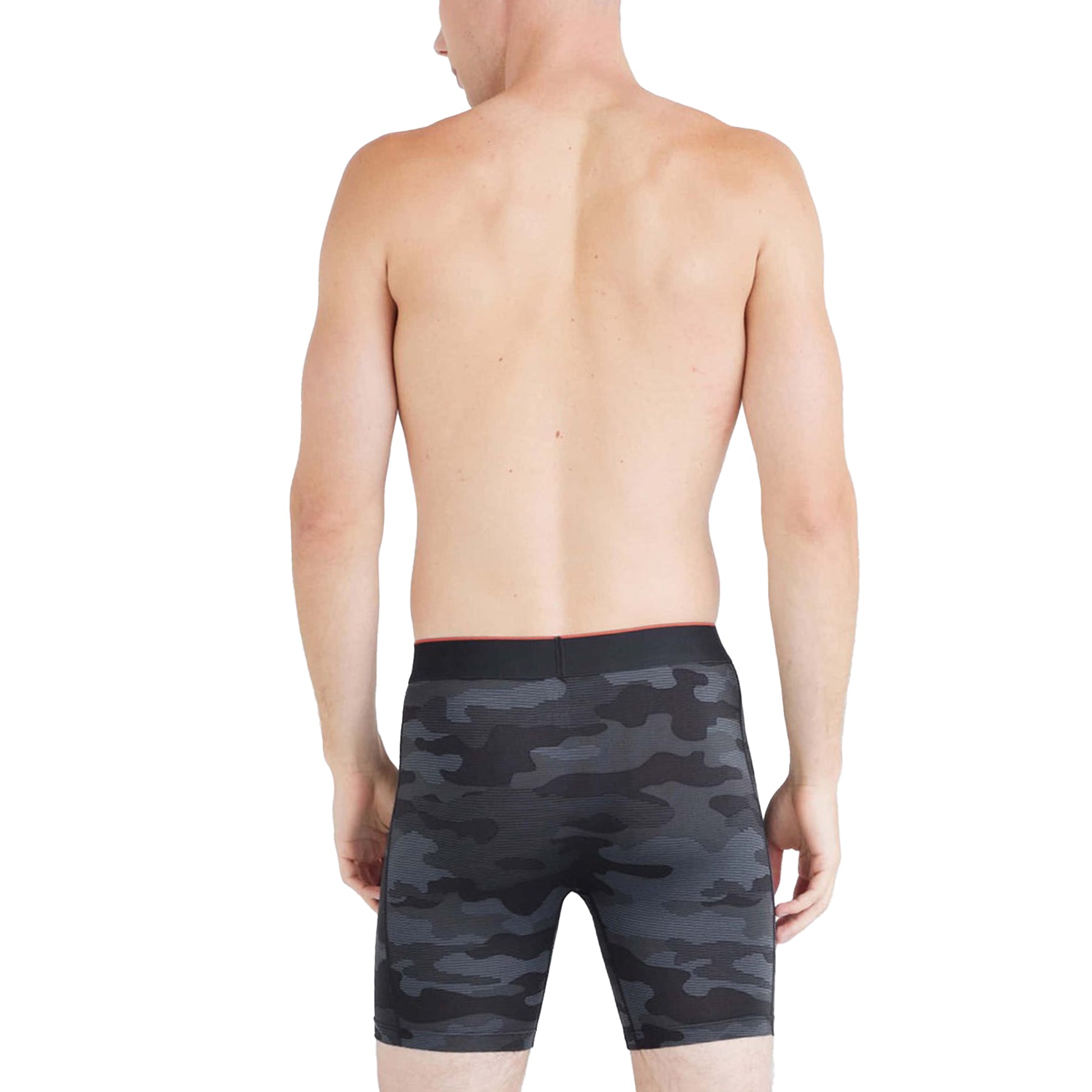 Person wearing black camouflage swim shorts on a white background
