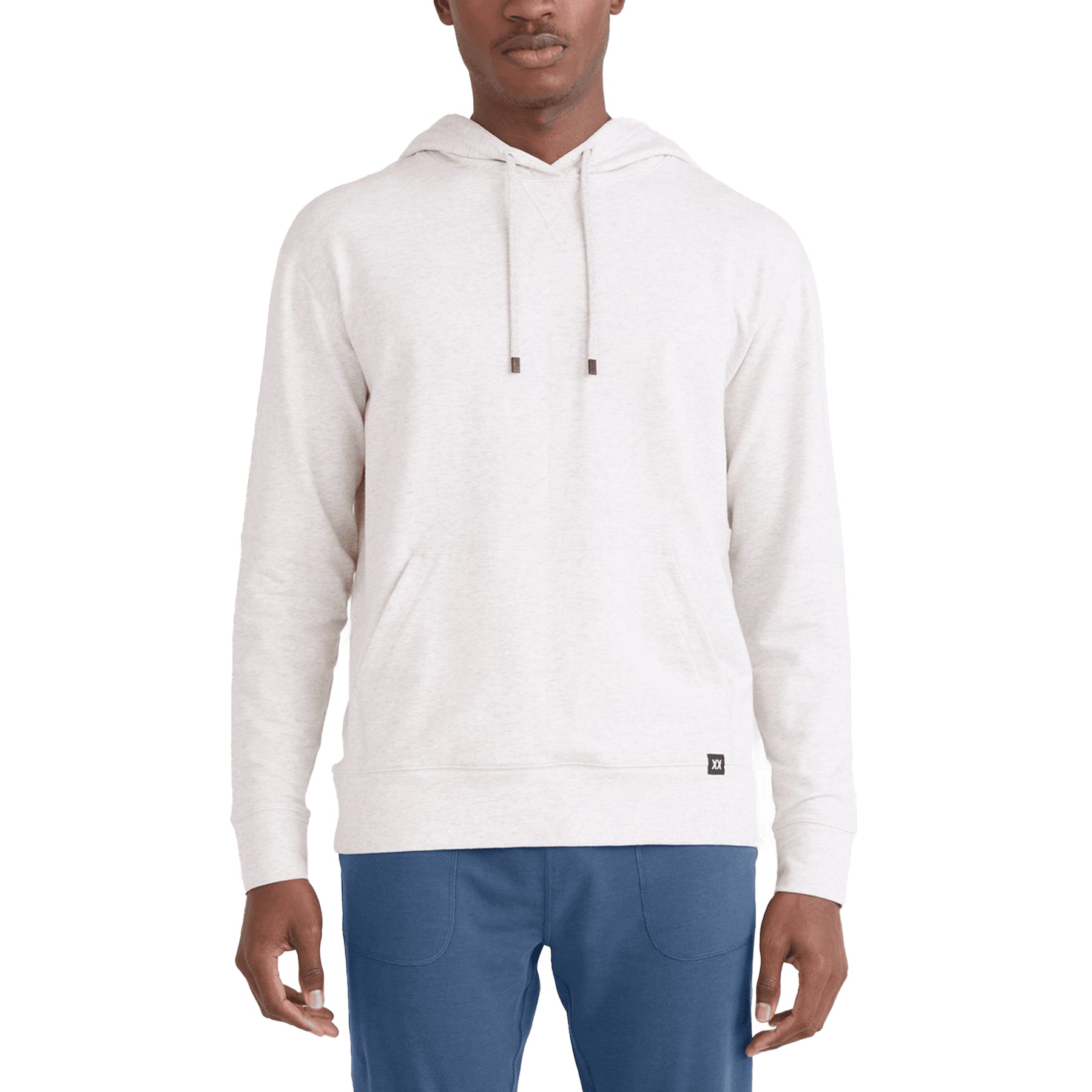 Front view of a man wearing a light heather grey pullover hoodie with a kangaroo pocket and drawstring hood.