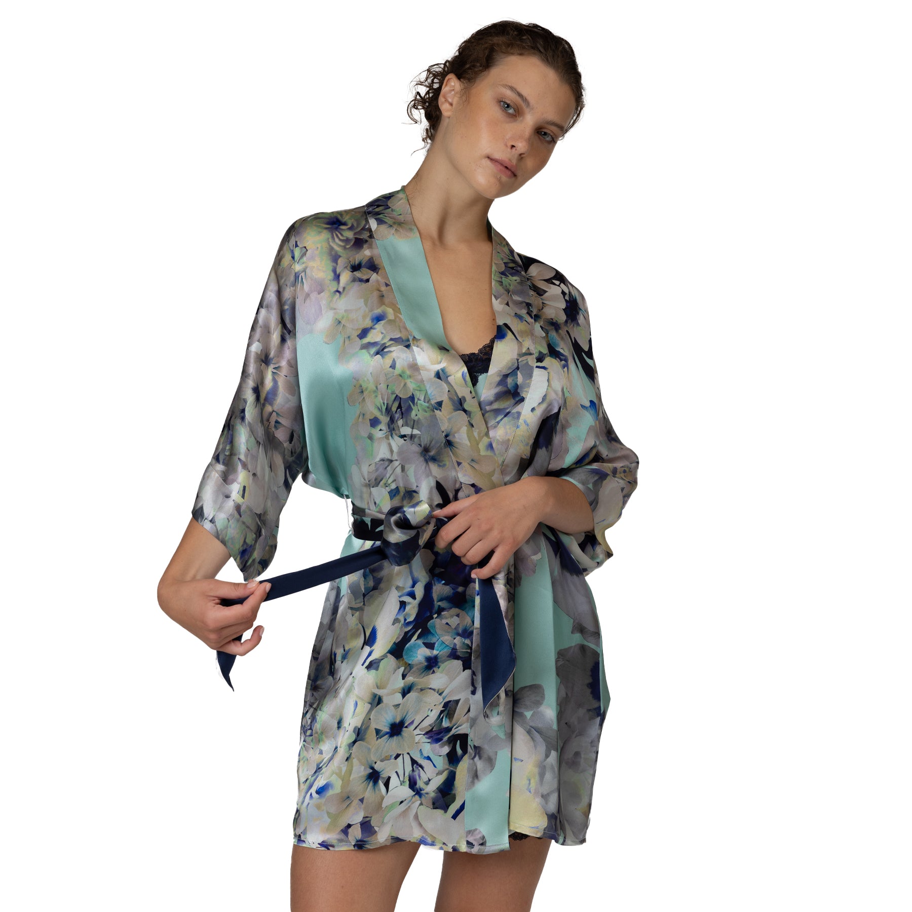 Short floral satin robe with soft aqua trim, tie waist, and elegant watercolour-inspired print in blue, grey, and ivory tones.