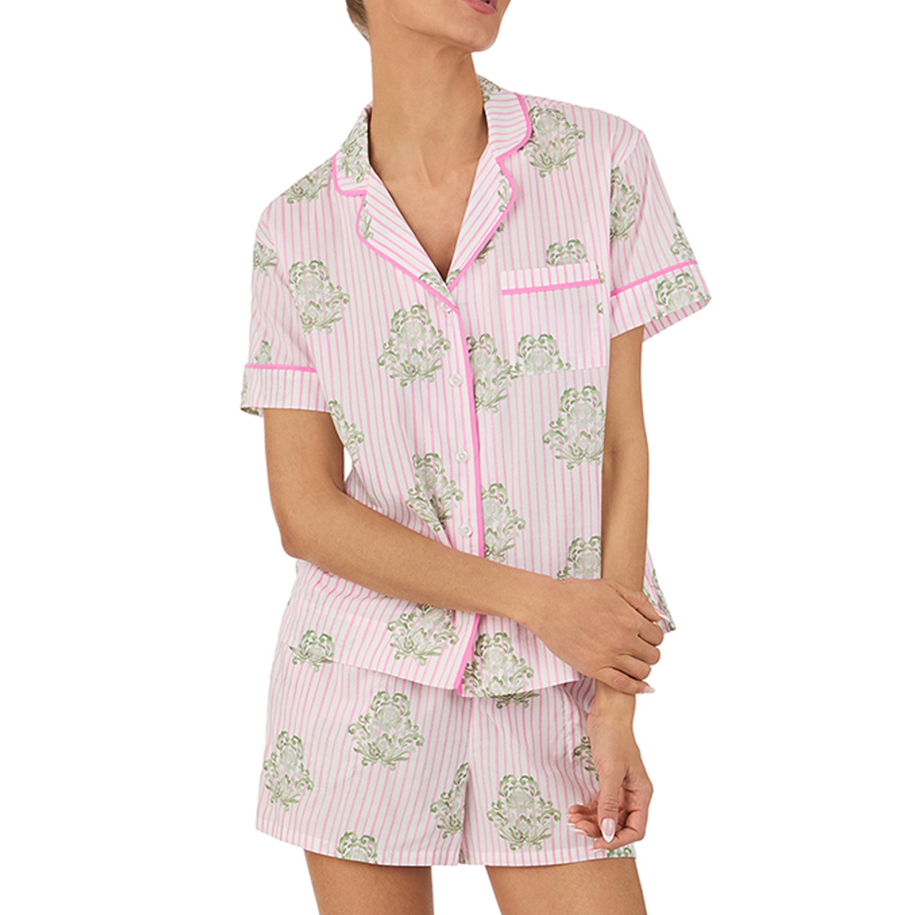 Close-up of pink striped pyjama shirt with green floral print, showcasing piping detail, collar, and chest pocket design