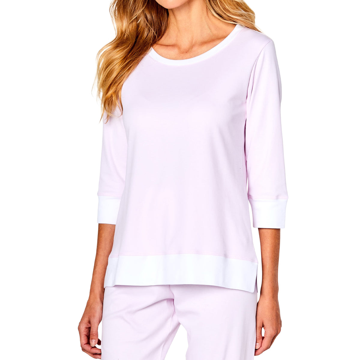 Close-up of Marchelle Marelle pink pyjama top featuring a round neckline, three-quarter sleeves, white cuffs and contrasting white hem.