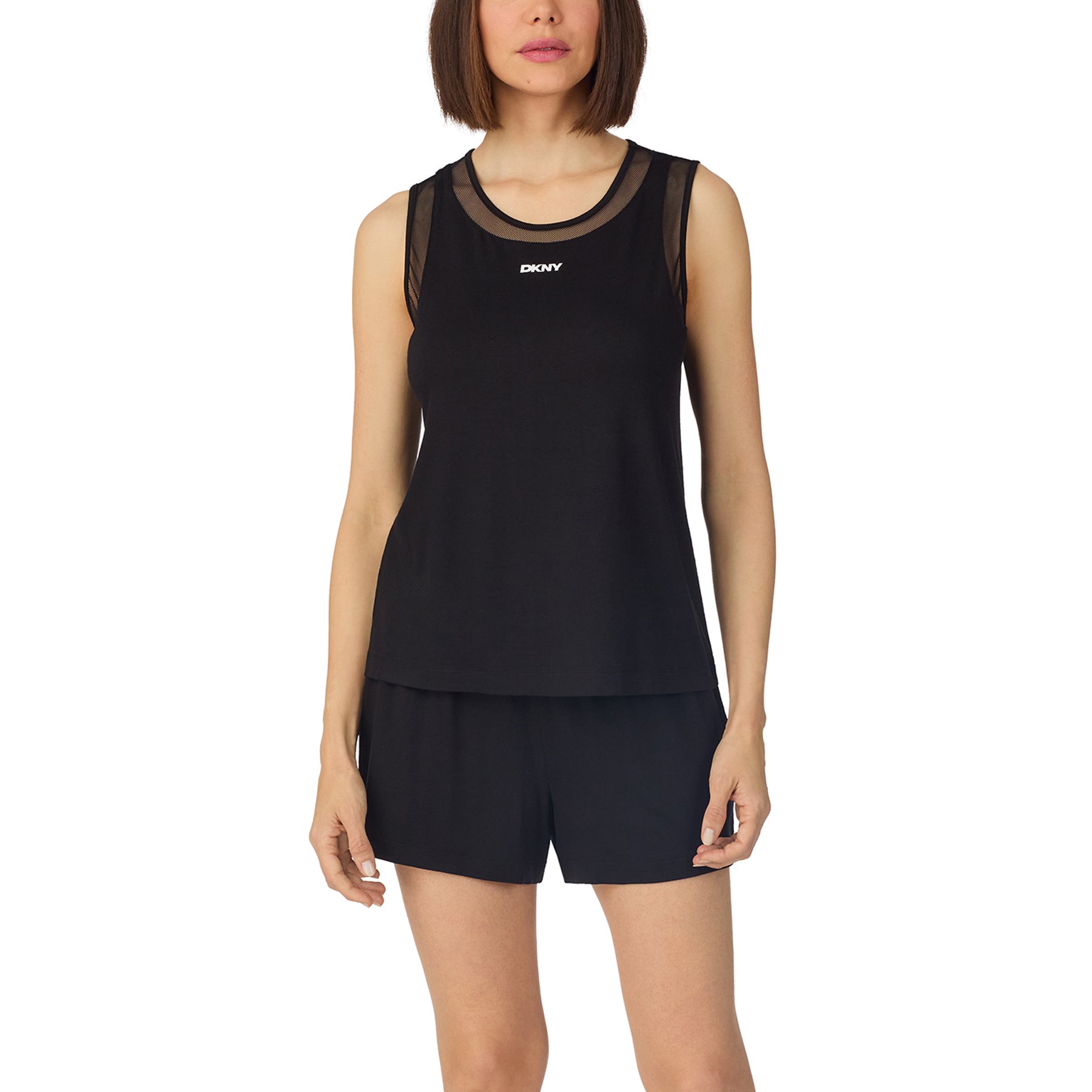 Woman wearing black DKNY sleeveless pyjama set with relaxed fit shorts