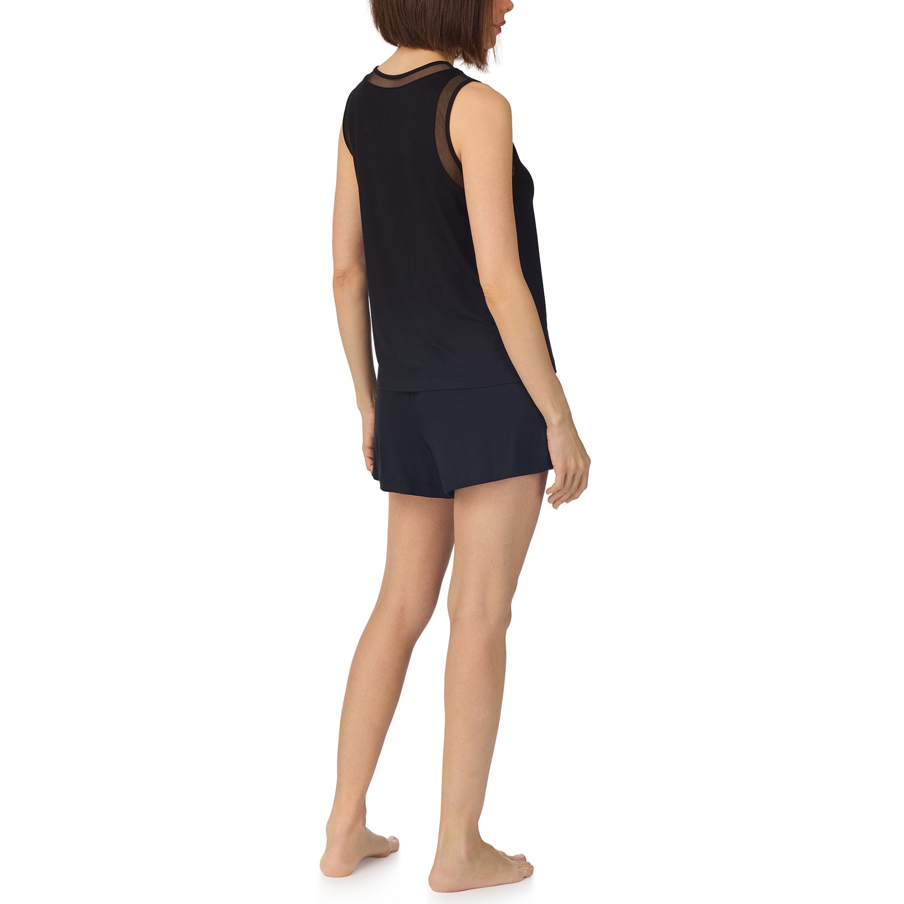 Back view of black DKNY sleepwear set with sheer mesh shoulder details and matching shorts