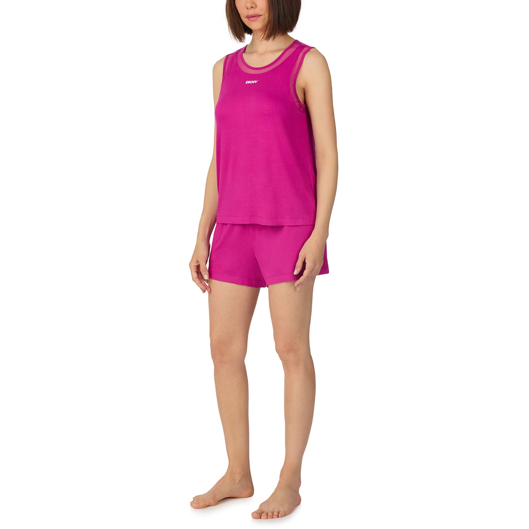 Side view of bright pink DKNY lounge set featuring sleeveless tank and soft shorts