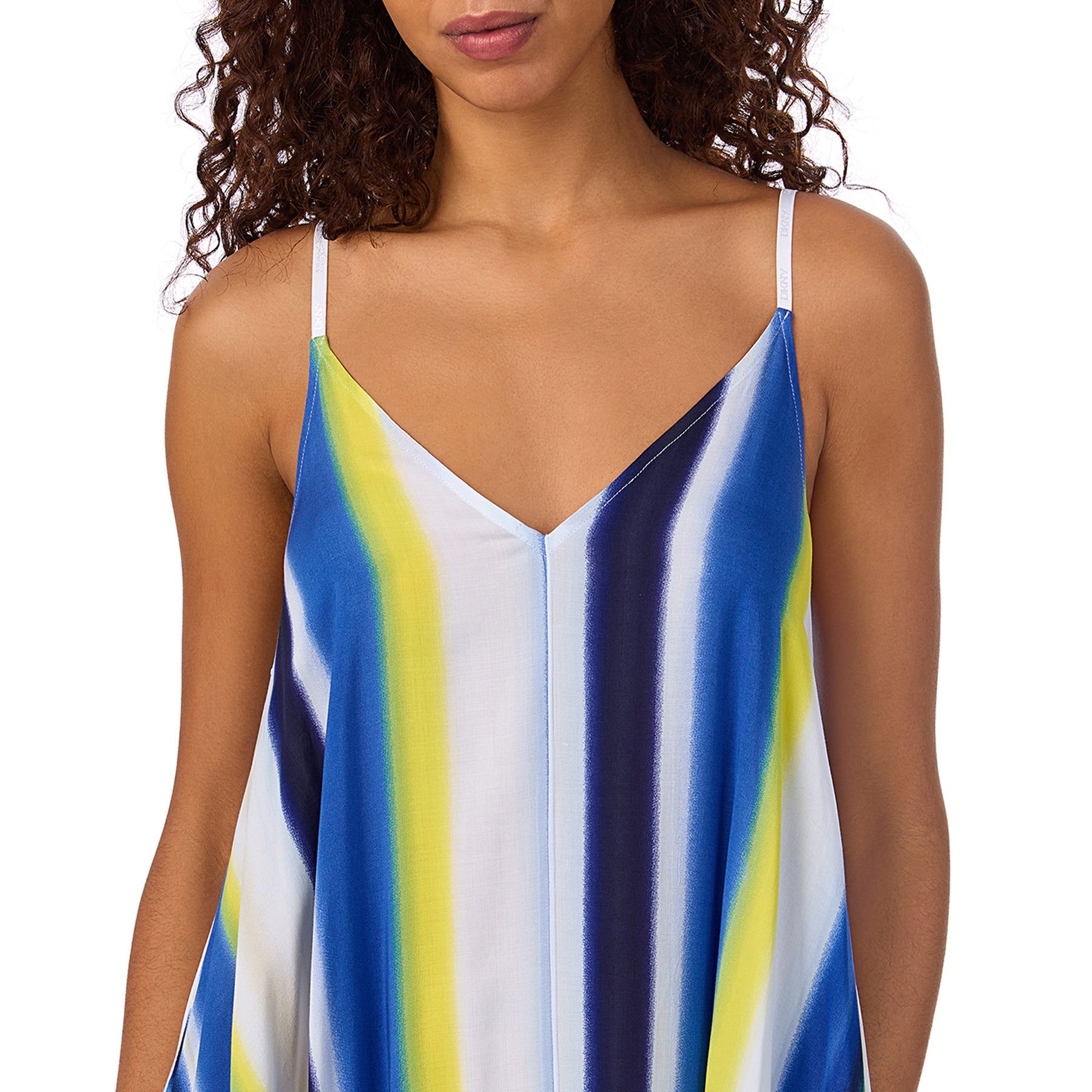 Close-up of V-neckline and shoulder straps on a striped sundress in blue, lime, and white hues.