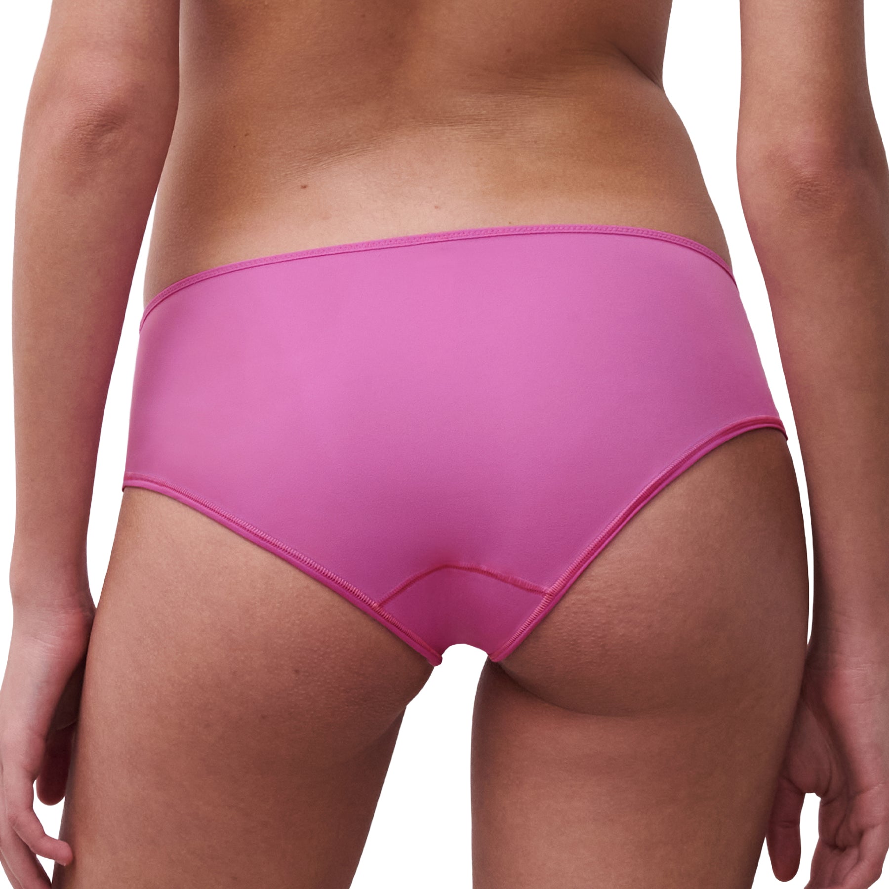 Back view of a pink mid-rise brief worn on model, featuring smooth fabric coverage and a clean, comfortable fit.