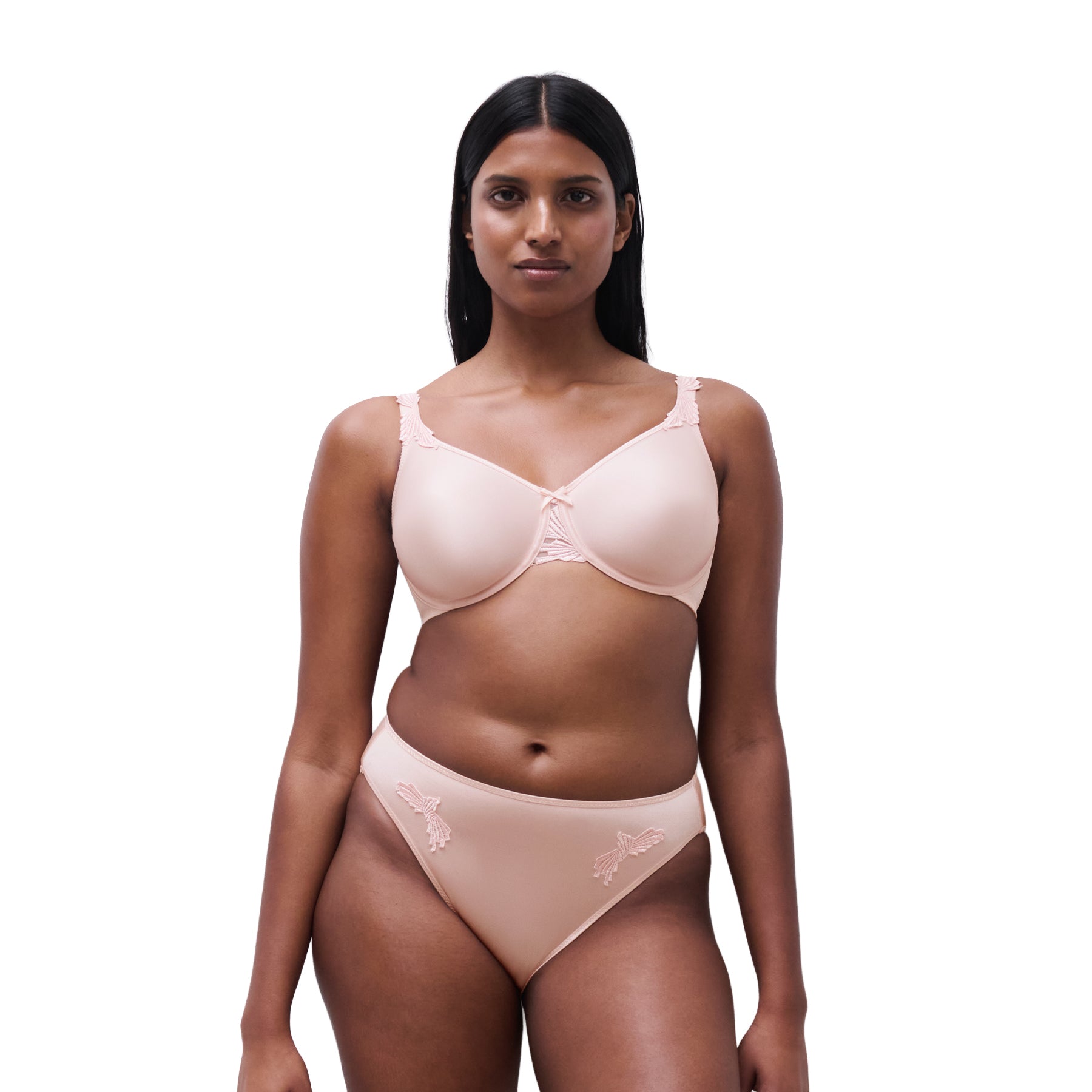 Front view of a nude full-cup bra worn with matching bikini brief, offering smooth coverage and a natural shape.