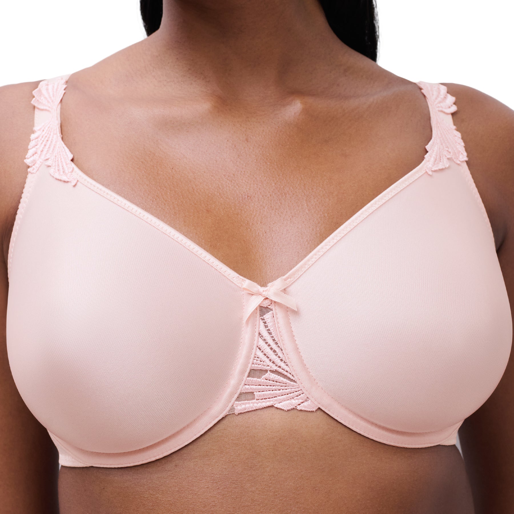 Close-up of a nude full-cup bra showing smooth cups, supportive fit, and delicate centre detailing.