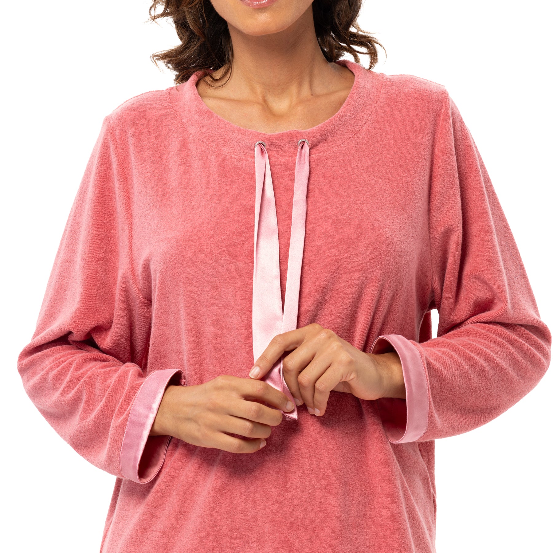 Close-up of pink velour lounge top featuring satin ribbon detail and cuff trim